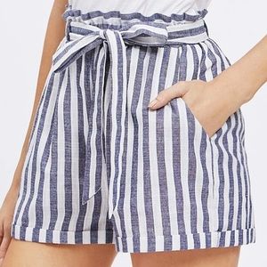 Blue and white striped paper bag shorts